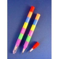 three different colored pens sitting next to each other on a blue surface with white writing