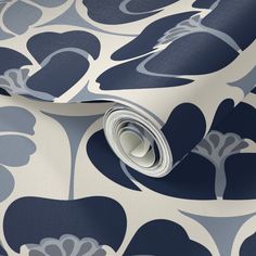 a blue and white wallpaper with large flower designs on it's side,