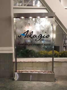 the sign for alegs is on display in front of an escalator