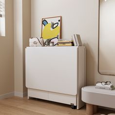 a white cabinet sitting in the corner of a room