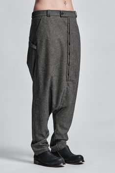 "Gray Melange Drop Crotch Lightweight Wool Trousers with Buttons__ // EXPRESS DELIVERY ONLY __Semi Visible Front Closure with Buttons __3 Front & 2 Back Pockets __Fully Completed Bound Seams __Elastic Backside Waistband __Lightweight Wool model__ bust 92 (36\"), waist 72 (28\"), hips 102 (40\"), biceps 28 (11''), height 177 (5'8\"), kg 65 (143 lbs) model wears size M | color: gray melange fabric__ 100 wool care__ dry cleaning do not bleach do not tumble dry sizing__ size XS (US 4, EU 34, IT Urban Clothing Men, Loose Leggings, Low Crotch Pants, Cropped Linen Trousers, Black Wool Blazer, White Linen Shirt, Cropped Linen Pants, Cotton Shirts For Men, Wool Trousers