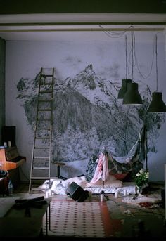 a living room with a ladder leaning up against the wall