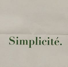 a piece of paper with the word simplicie written in green on it