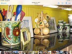 an image of a kitchen counter top with pictures and utensils on it