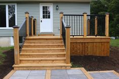 wooden steps leading up to the front door of a house