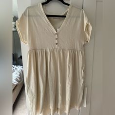 Urban Outfitters Button Up Babydoll Dress Size Extra Small, Runs Large New With Tags Beige Short Sleeve Mini Dress With Buttons, Cream Buttoned Dress For Daywear, Cotton Day Dress With Button Back, Cream Button Dress For Daywear, Cotton Daywear Dress With Button Back, Casual Cream Cotton Mini Dress, Cream Casual Cotton Mini Dress, Cream Cotton V-neck Mini Dress, Cream Cotton Dress With Buttons