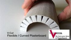 a person holding a piece of paper with the words v - cut flexible / curved plaster board