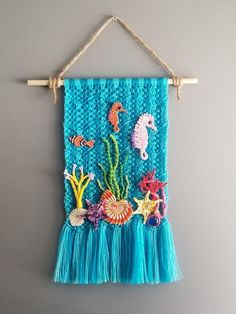 a blue wall hanging with sea animals on it