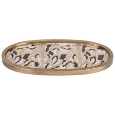 an oval metal tray with gold and black animal print on the bottom, in front of a white background