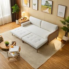 a living room filled with furniture and wooden flooring on top of a hard wood floor