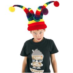 a young boy wearing a colorful hat and holding a pizza box with the word surprise written on it