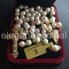 Elegant Gold Rosary For Gift, Elegant Gold Rosary As Gift, Elegant Rosary With 8mm Beads And Crucifix, Elegant Yellow Gold Rosary With Crucifix, Elegant Cross Rosary For First Communion, Elegant Pearl Rosary With 8mm Beads, Elegant Pearl Rosary With Cross, Gold Pearl Crucifix Jewelry, Elegant Round Beads Rosary For First Communion