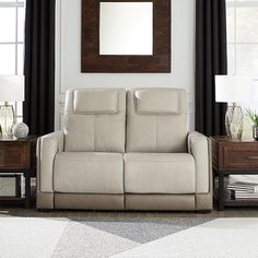 a living room scene with focus on the reclining sofa