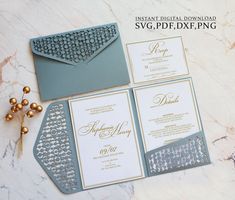 the wedding stationery is laid out on top of the table with gold and silver decorations