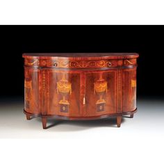 an ornately decorated wooden cabinet with drawers