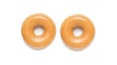 two glazed donuts on a white background