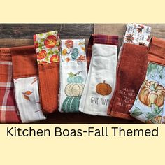 the kitchen towels are lined up together on the table with text overlay that reads kitchen boas - fall themed