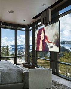 a bedroom with a large flat screen tv mounted to the wall