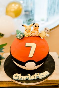 a pokemon birthday cake with pikachu and friends on top