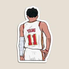 the back of a basketball player's jersey with his hand on his hip and wearing an arm cast