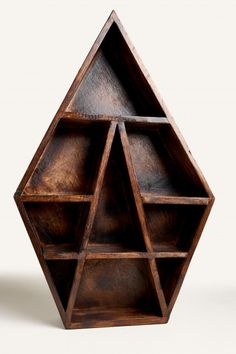 a wooden shelf with three shelves in the shape of an octagon shaped object