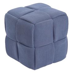 a blue square ottoman sitting on top of a white floor