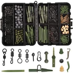 an assortment of green and white items in a black case with dividers, spoons, tongs