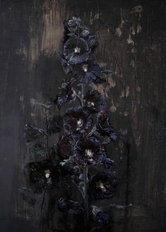 a painting of flowers in a vase on a wooden surface with dark colors and black background