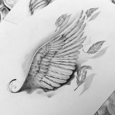 a drawing of an angel wing with roses and leaves on the side, in black and white