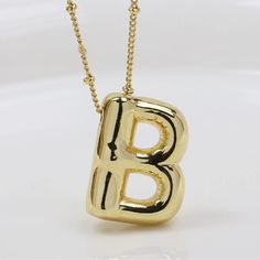 Bubble/Balloon Letter B Initial Necklace Elevate Your Style With Our Very Popular Gold Bubble Initial Necklace. Balloon Letter Pendant On A Delicate Beaded Satellite Chain. Chain Length - 17 1/2- 19 1/2 Inches All Jewelry Comes Beautifully Packaged And Ready For Gift Giving. #Balloon #Bubble #Necklace #Initial #Gold B Necklace, Black Long Necklace, Chunky Gold Necklaces, Gold Collar Necklace, Gold Bubbles, Sterling Silver Heart Necklace, Bubble Balloons, Stone Beaded Necklace, Letter Balloons