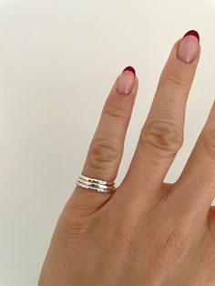 Dainty Pinky Ring Stacking Set | Recycled Sterling 925 Silver | Handmade Sterling Silver Stacking Ring Set | Hammered Solid Silver Ring | Stackable Rings | Silver Pinky Ring | Pinky Ring Woman This stacking ring set consists of three pinky rings handmade from recycled sterling silver. Each ring is 1.5mm wide and has a different texture/finish.  Handmade from 100% recycled sterling (925/solid) silver.  Recyclable packaging.  This set of rings are also available to purchase in larger sizes (link below)  https://www.etsy.com/uk/listing/1391528620/3-x-15mm-recycled-sterling-silver?click_key=8eaf5cd2e2b8b53c834510481d4cf6d0efb3d7a1%3A1391528620&click_sum=1de6e709&ref=shop_home_active_26&frs=1&sts=1 All orders include a personalised thank you note. If you would like to send as a gift with a gift Silver Pinkie Ring, Rings Inspo Silver, Ring Stacks Silver, Silver Rings Aesthetic, Silver Ring Stack, Silver Pinky Ring, Pinky Rings, Hand Rings, Stackable Rings Silver