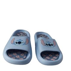 Step Into The Magical World Of Disney With These Stylish Flip Flops Featuring Stitch And A Blue Floral Pattern. Slip Them On With Ease, Thanks To Their Lightweight Design And Flat Heel Style. Perfect For Women Who Love Sandals, These Rubber-Made Shoes Are Part Of The Disney Product Line And Feature A Cute Logo Accent. The Shoes Come In Size 11 For Us Shoe Size And 9.5 For Uk Shoe Size, With An Eu Shoe Size Of 40.5 And An Au Shoe Size Of 10.5. They Are Not Customized And Are Not Vintage. Add Thes Casual Synthetic Flip Flops For Playtime, Comfortable Blue Slippers For Vacation, Casual Non-slip Flip Flops, Cute Blue Sandals For Vacation, Casual Blue Slippers With Soft Sole, Cute Blue Flip Flops For Vacation, Blue Sandals With Soft Sole For Playtime, Cartoon Style Sandals For Beach In Summer, Blue Synthetic Slippers For Vacation