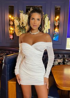 The Kylie dress features a stunning white mesh material with added sparkles in the fabric, long sleeves and ruched detailing throughout. This stunning white mini dress is the perfect addition to your bridal party or hen do events. Pair with silver jewellery and our Cinderella bag and you will be sure to turn heads wha Kylie Dress, Grad Photoshoot, Mesh Mini Dress, Glam Outfit, Blonde Hair Blue Eyes, Dynamic Duo, Hen Do, Short Prom, Satin Midi Dress