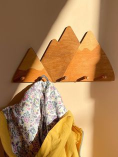 a coat rack with clothes hanging on it