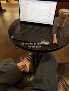 a person sitting at a table with a laptop on their lap and the caption reads she decided to study hard for her goals