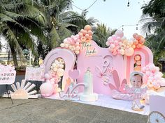 a baby's first birthday party with balloons and decorations