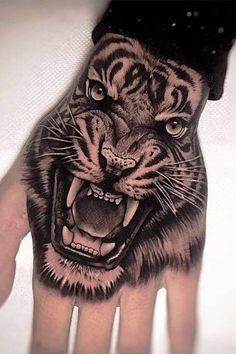 a hand that has a tiger on it with the words instagramm above it