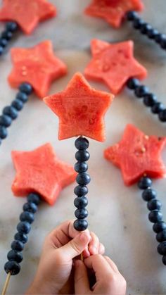 someone is holding up some candy stars to make them look like they are made out of gum