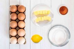 eggs, butter and other ingredients on a white table