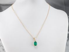 This lovely necklace was crafted in our shop, using both vintage and modern pieces. The center gem is a deep, gorgeous green emerald from our collection! We've used a brilliant diamond as an accent, and set them both in a simple yellow gold pendant with clean, simple lines. Set perfectly on a yellow gold rolo 16-inch chain, making this stunning piece ready to wear or gift! Metal: 18K Yellow Gold Gem: Emerald 2.57 Carats Gem Measurements: 12.0 x 8.2 mm, Pear Cut Accents: Diamond .42 Carats, F in Emerald And Diamond Necklace, Chain Making, Emerald Necklace, Lovely Necklace, Yellow Gold Pendants, Green Emerald, Brilliant Diamond, Simple Lines, Pear Cut