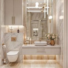 a bathroom with marble walls and flooring, white toilet and sink in the center