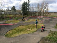 several people riding dirt bikes on an outdoor course