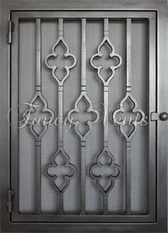 an iron door with decorative designs on the front and side panels, which are handmade in