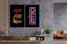 two neon signs are hanging on the wall above a table in a room with wood flooring