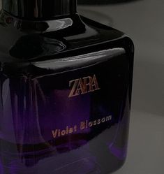 a bottle of zara violet blossom perfume