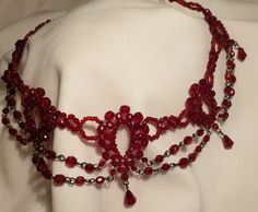 Very beautiful and unique necklace. Made from little glass/crystals beads bonded together into collar. Red Crystal Round Bead Necklaces, Red Crystal Round Bead Necklace, Red Crystal Necklace With Round Beads, Elegant Red Crystal Beaded Necklaces, Elegant Red Beaded Choker, Red Crystal Beaded Necklaces With Round Beads, Red Crystal Beaded Necklace With Round Beads, Red Beaded Choker For Party, Elegant Red Choker With Round Beads