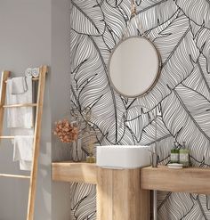 a bathroom with a mirror, sink and ladder in front of a wallpapered design