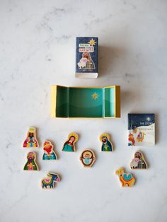 the nativity cookies have been placed next to each other on a marble countertop