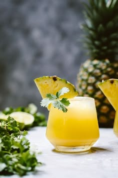 a pineapple margarita with garnish on the rim