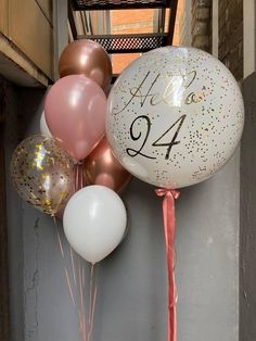 balloons and streamers with the number twenty four on them